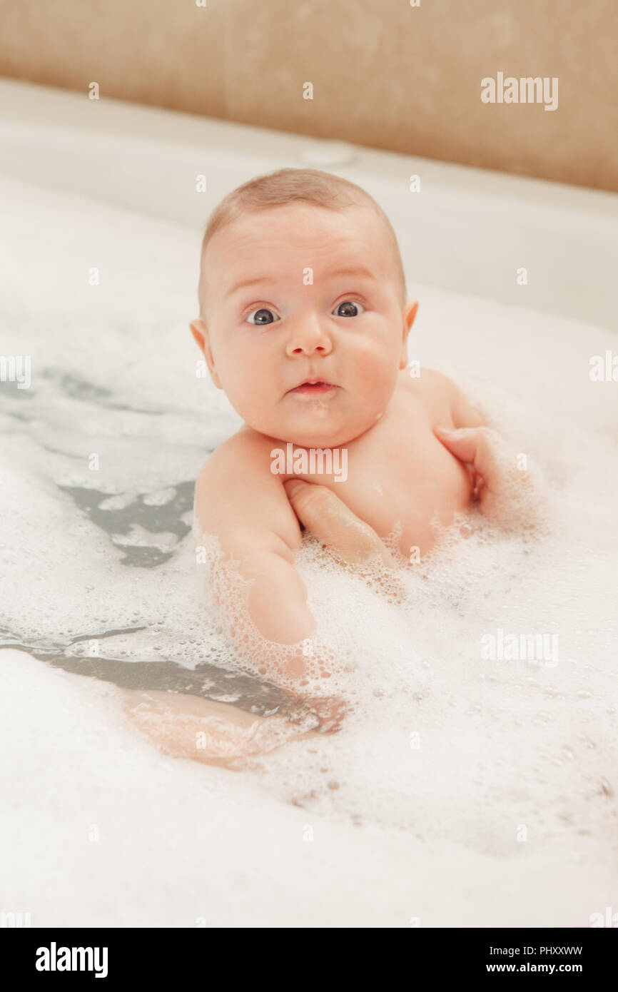 Newborn baby taking bath foam hires stock photography and images Alamy