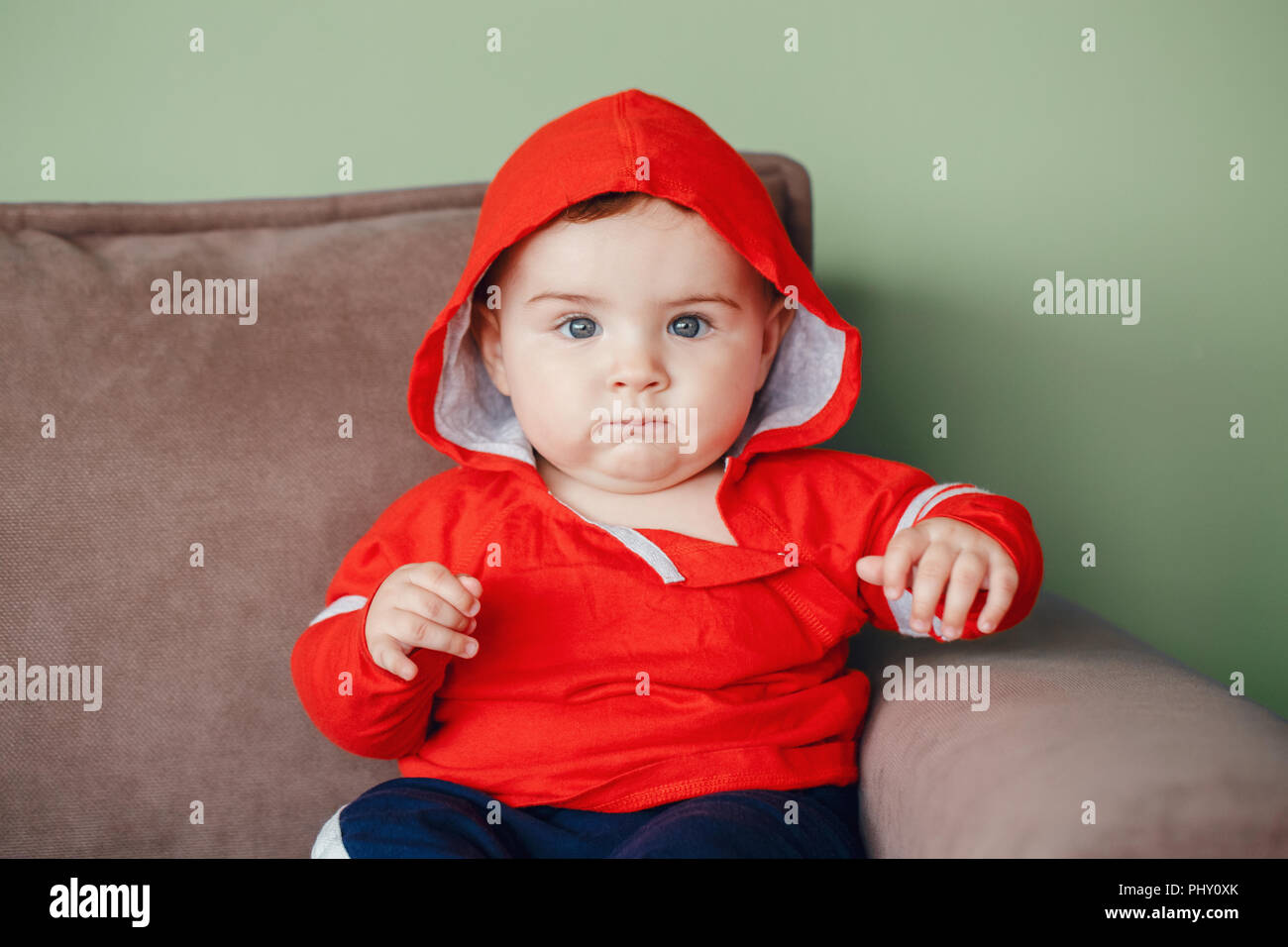 Portrait of cute adorable Caucasian smiling baby boy with blue