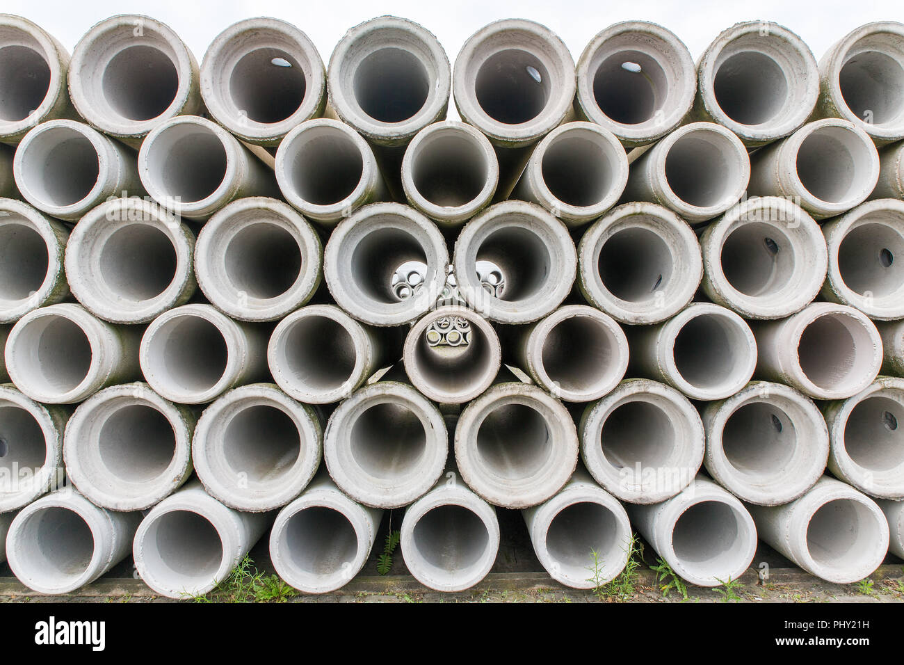 Stack of concrete sewer pipes at dutch factory Stock Photo
