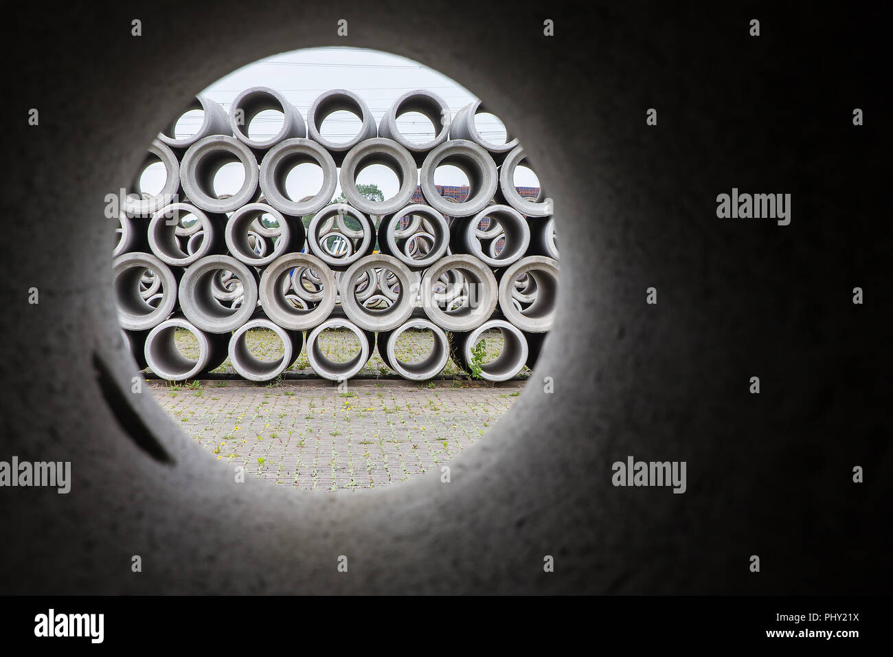 Circular look through concrete sewer pipe Stock Photo