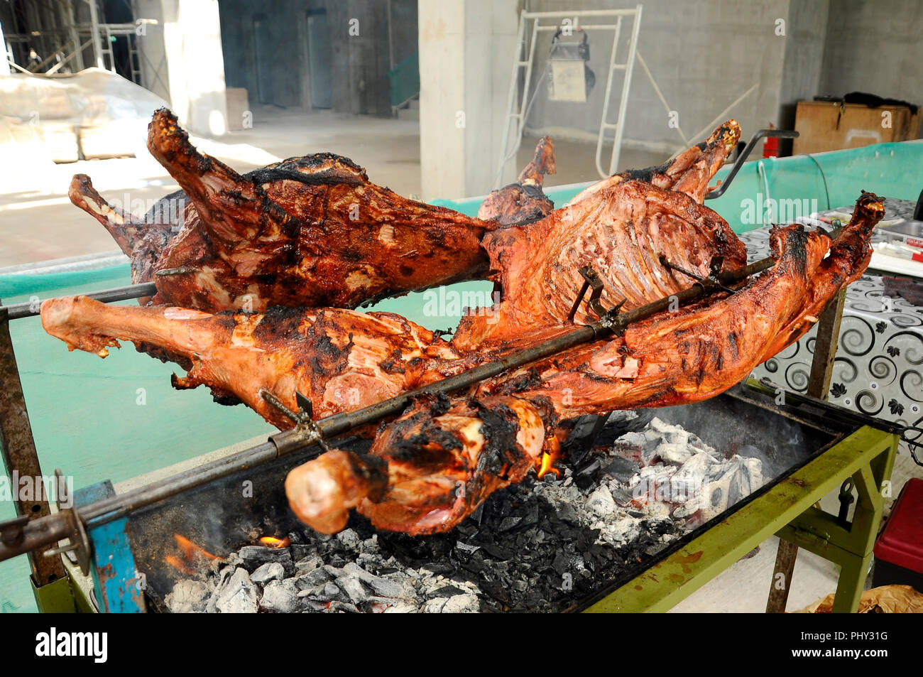 The raw lamb meat has been mixed with various spices and grilled using