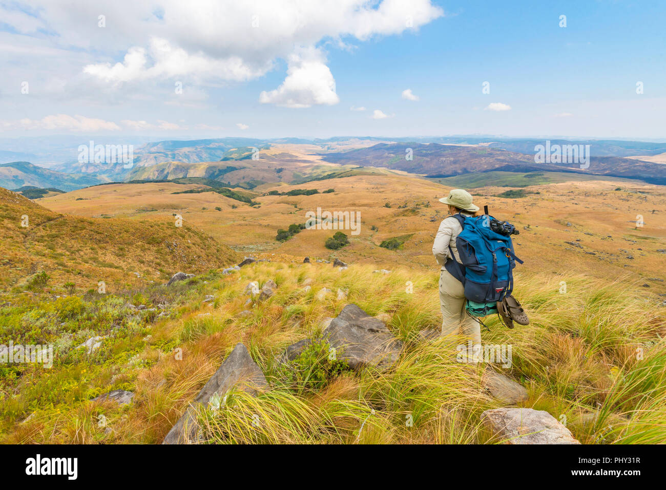 A hiker observes stunning views in Zimbabwe's Nyanga National Park ...