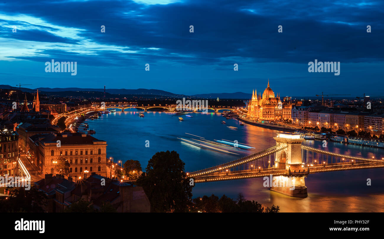 Panoramic view of Budapest at night. Danube river, Széchenyi Chain Bridge, and the Parliament, long exposure Stock Photo