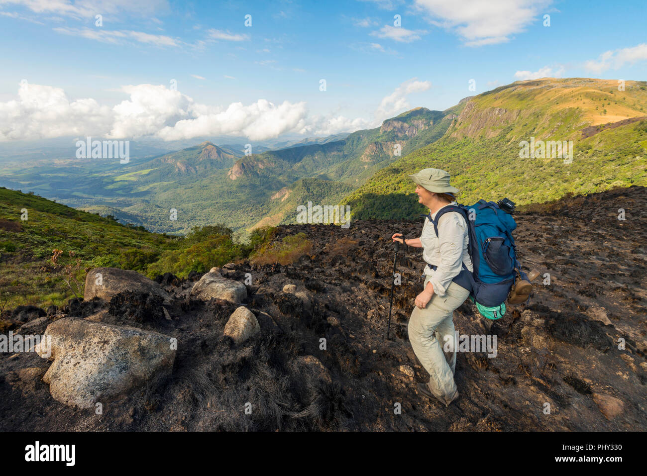 A hiker observes stunning views in Zimbabwe's Nyanga National Park ...