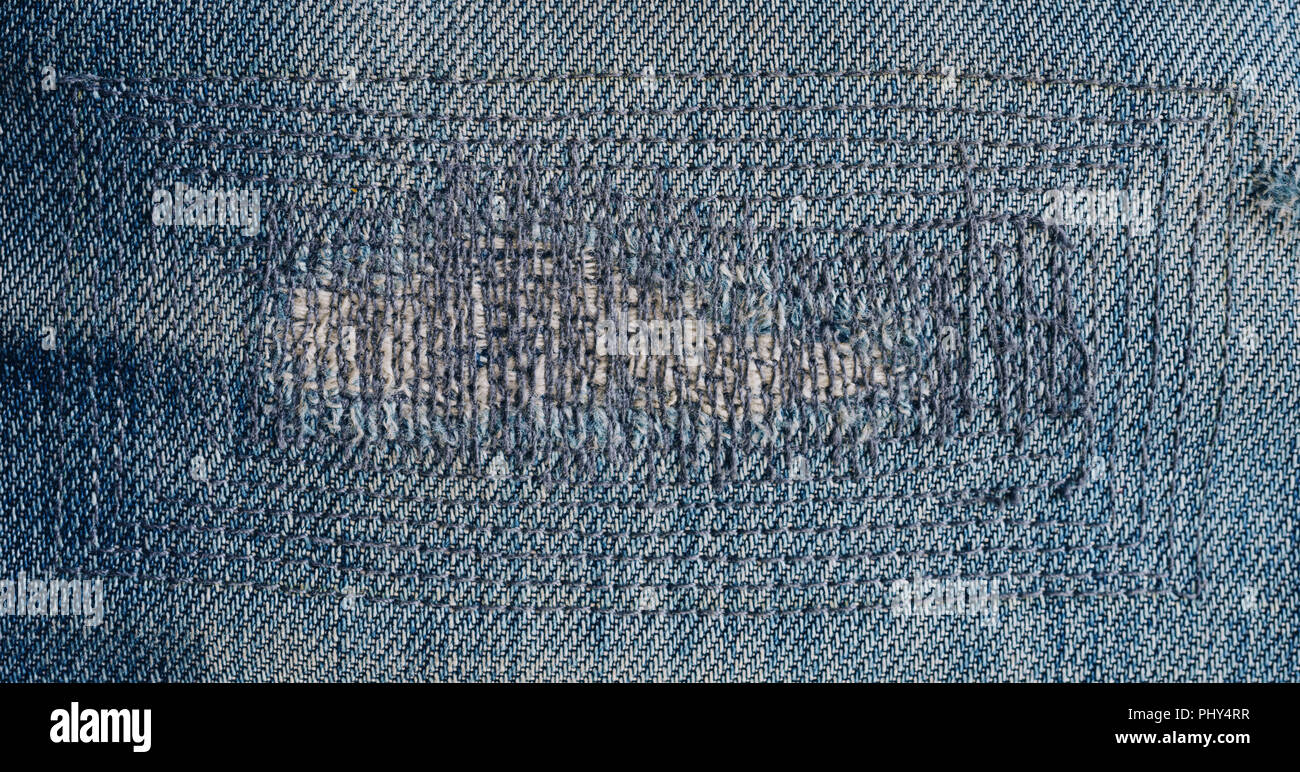 close up patch old jeans denim texture and background. Stock Photo