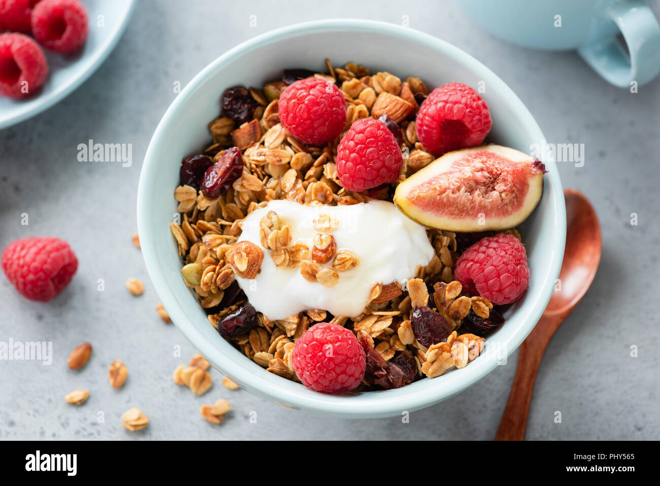 Tasty granola with greek yogurt and fresh berries in a bowl. Healthy