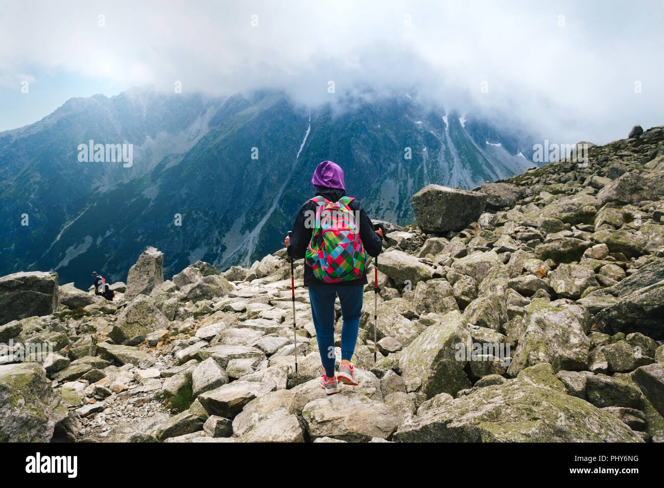 Mount Rysy, Tatras, Slovakia. Woman traveler with backpack and tracking ...