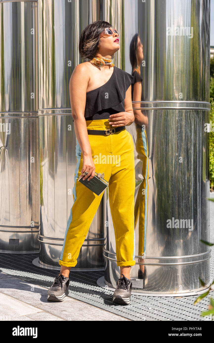 Beautiful young Indian woman posing in an urban context. Street fashion ...