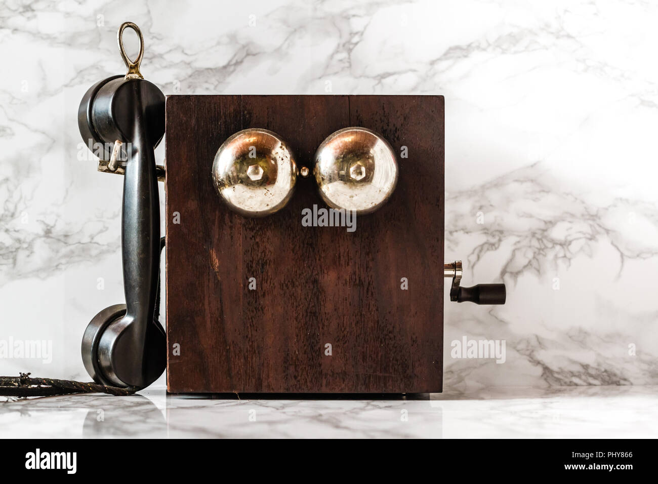 Antique hand crank telephone set on marble background Stock Photo Alamy