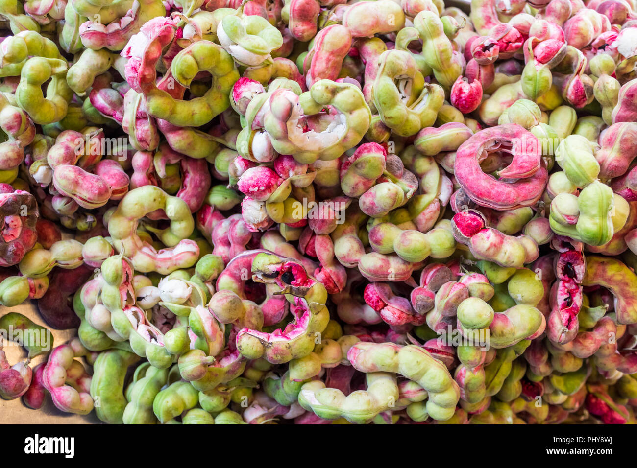Pile of ripe Pithecellobium dulce beans (Manila Tamarind) in Thai market Stock Photo