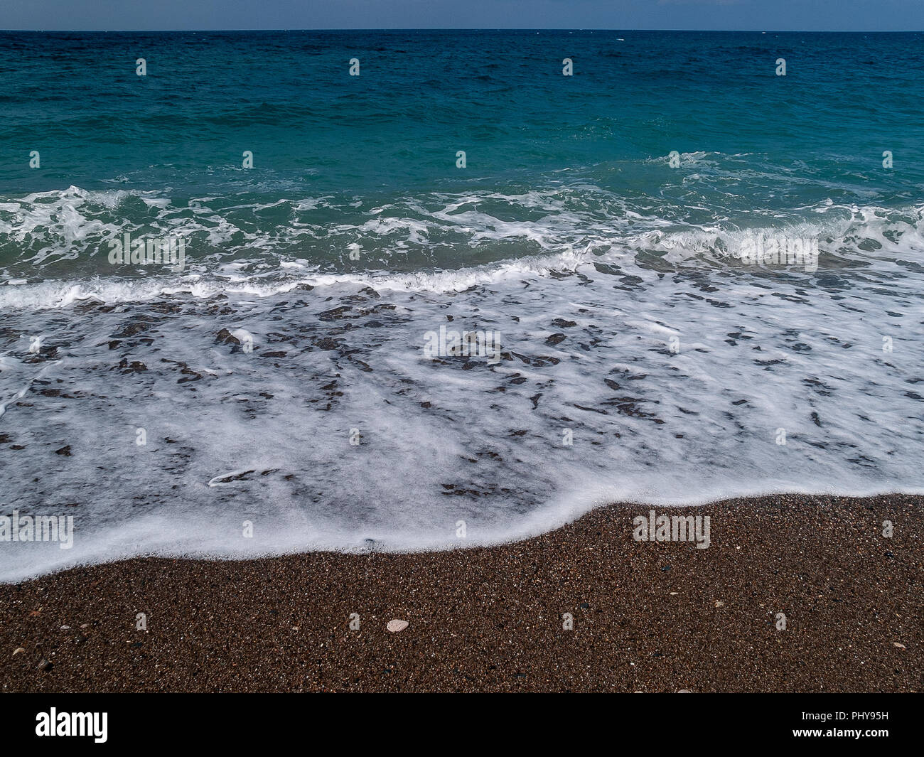 The black sand beach at Wadi Qandil. Mediterranean Sea, Syria. Stock Photo