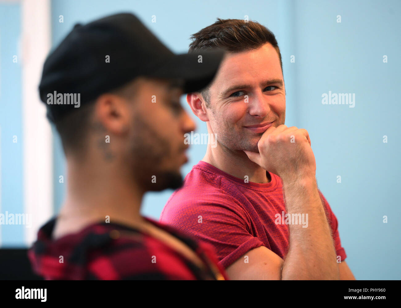 (left to right) Aston Merrygold (left) and Harry Judd during an interview with the Press Association about their forthcoming Rip It Up tour, at Dance Attic in west London. Stock Photo