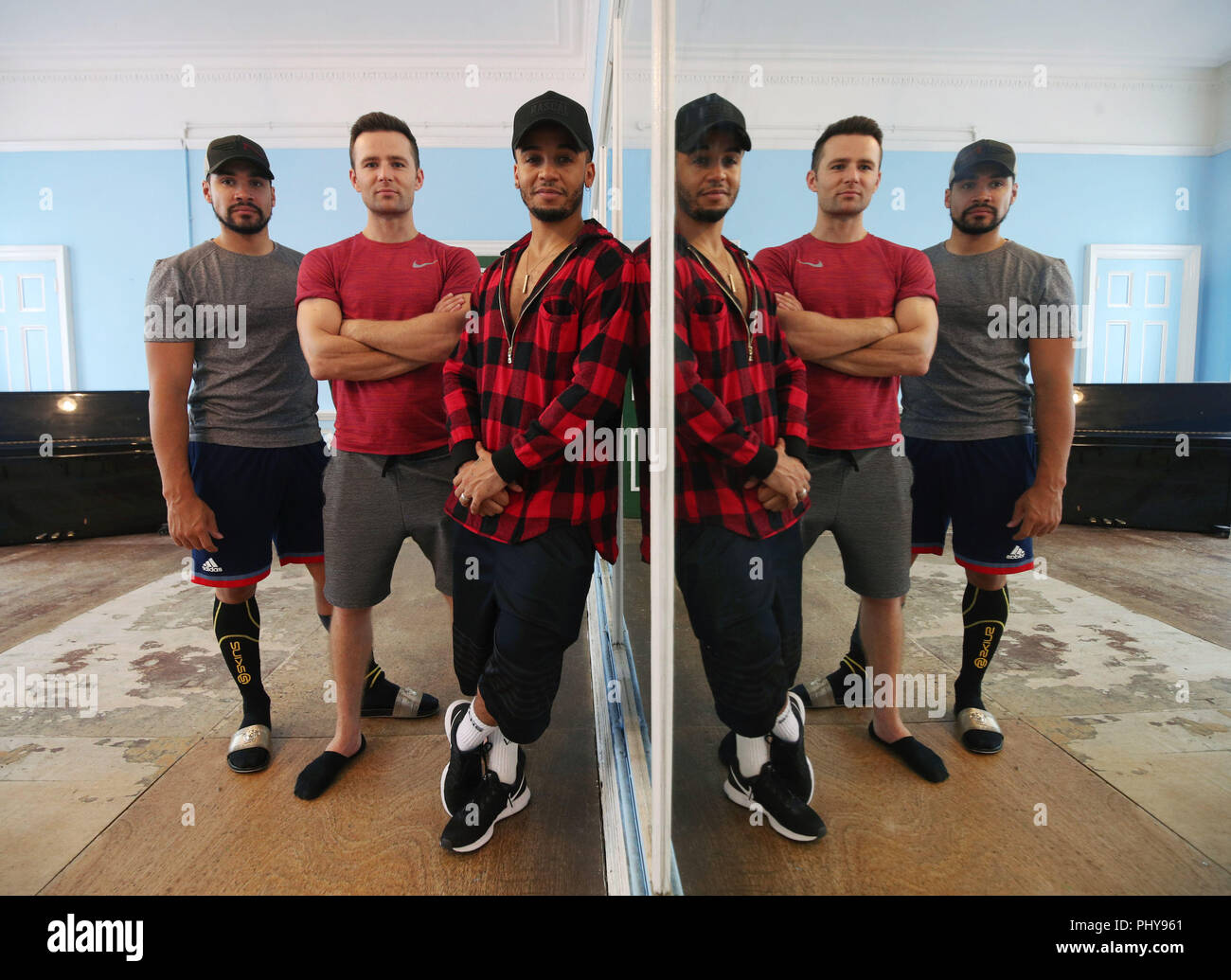 (left to right) Louis Smith, Harry Judd and Aston Merrygold pose for a group portrait after an interview with the Press Association about their forthcoming Rip It Up tour, at Dance Attic in west London. Stock Photo