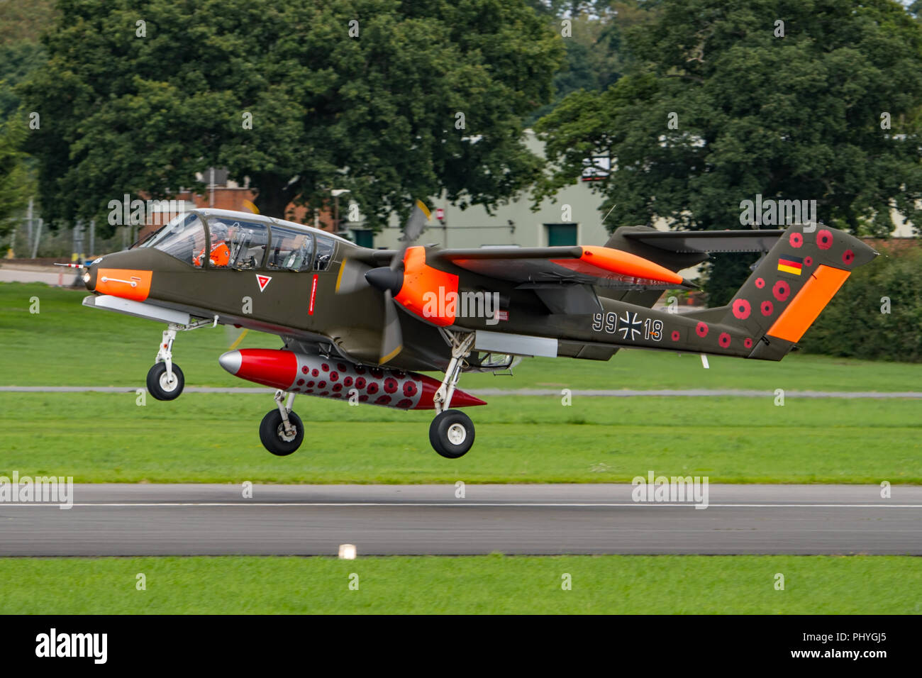 The North American Rockwell OV-10 Bronco in it's 'Poppy' livery to commemorate the end of the Great War 100 years ago. Landing at Dunsfold on 25/8/18. Stock Photo