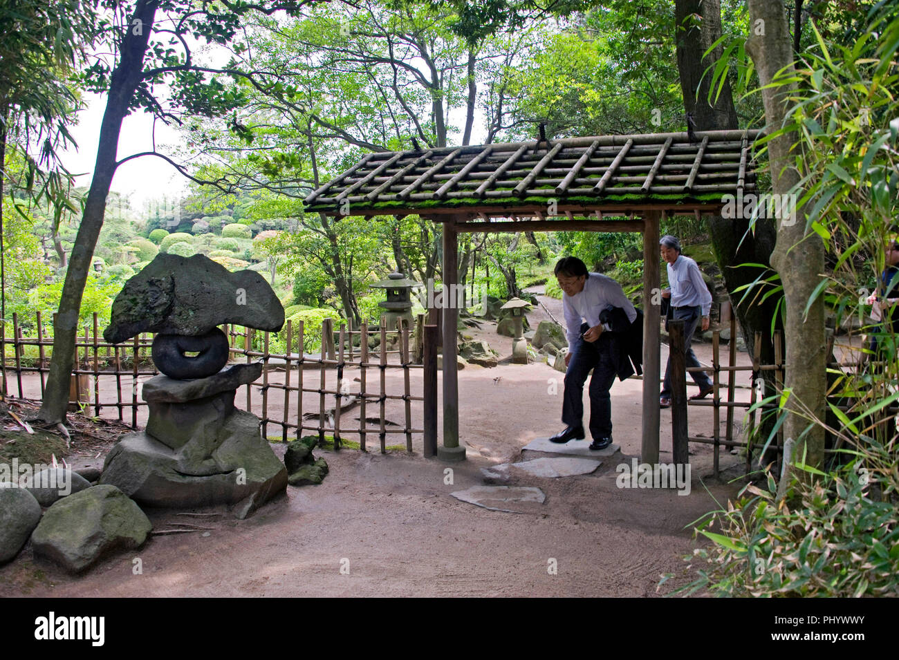 Visitors enter the main torii gate of the main building of the Honma
