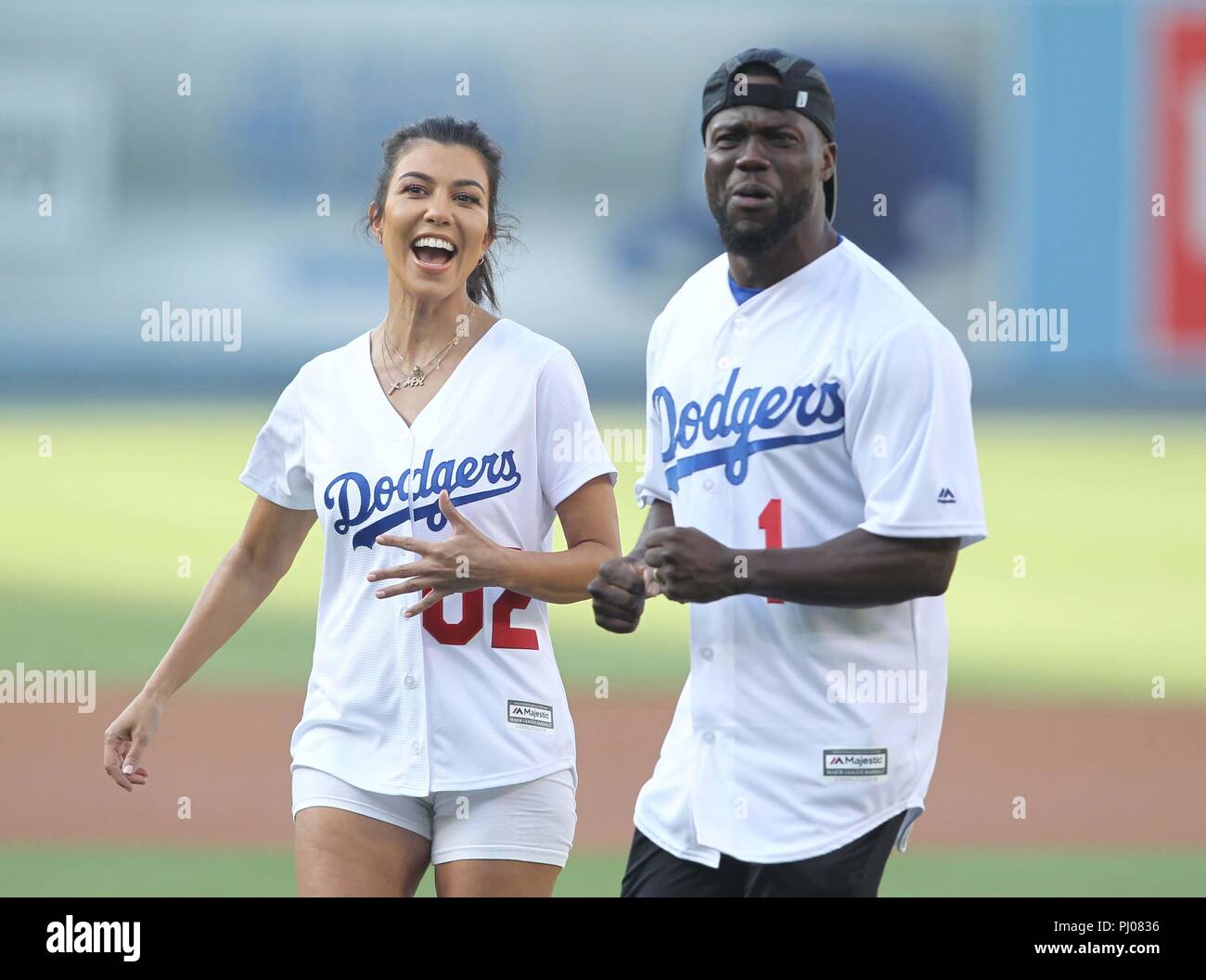 Kourtney Kardashian and Kevin Hart throw out the first pitch as the Los