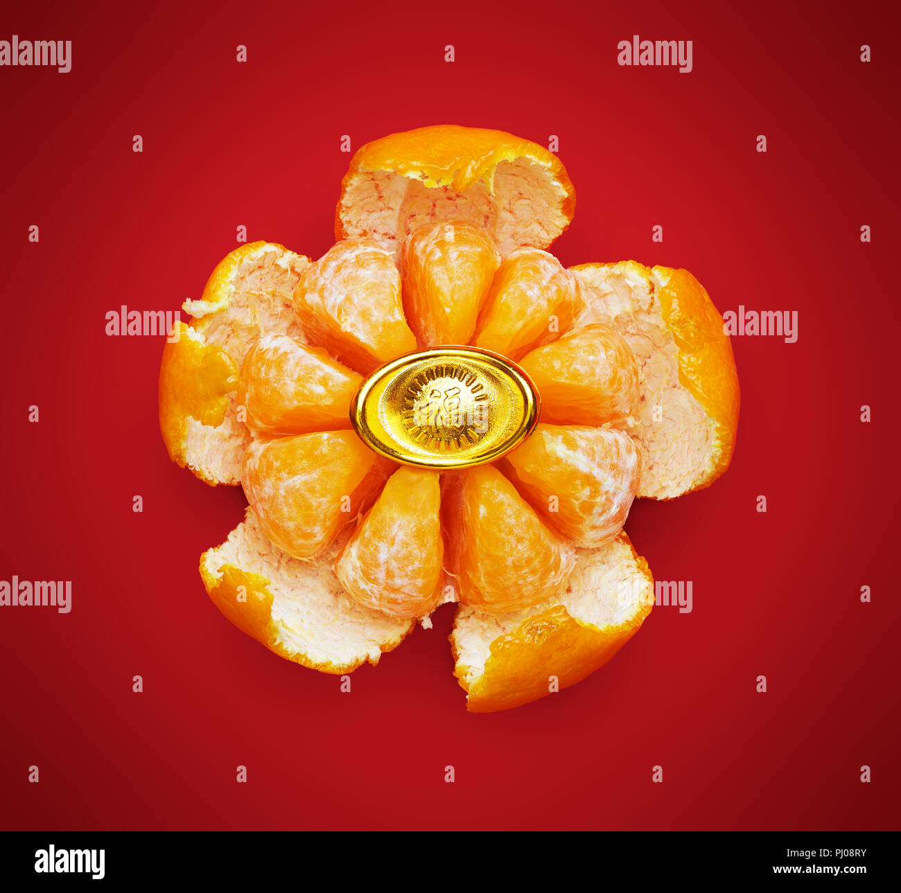 Mandarin orange peel into flower shape (chinese calligraphy means Prosperity), Clipping path included Stock Photo
