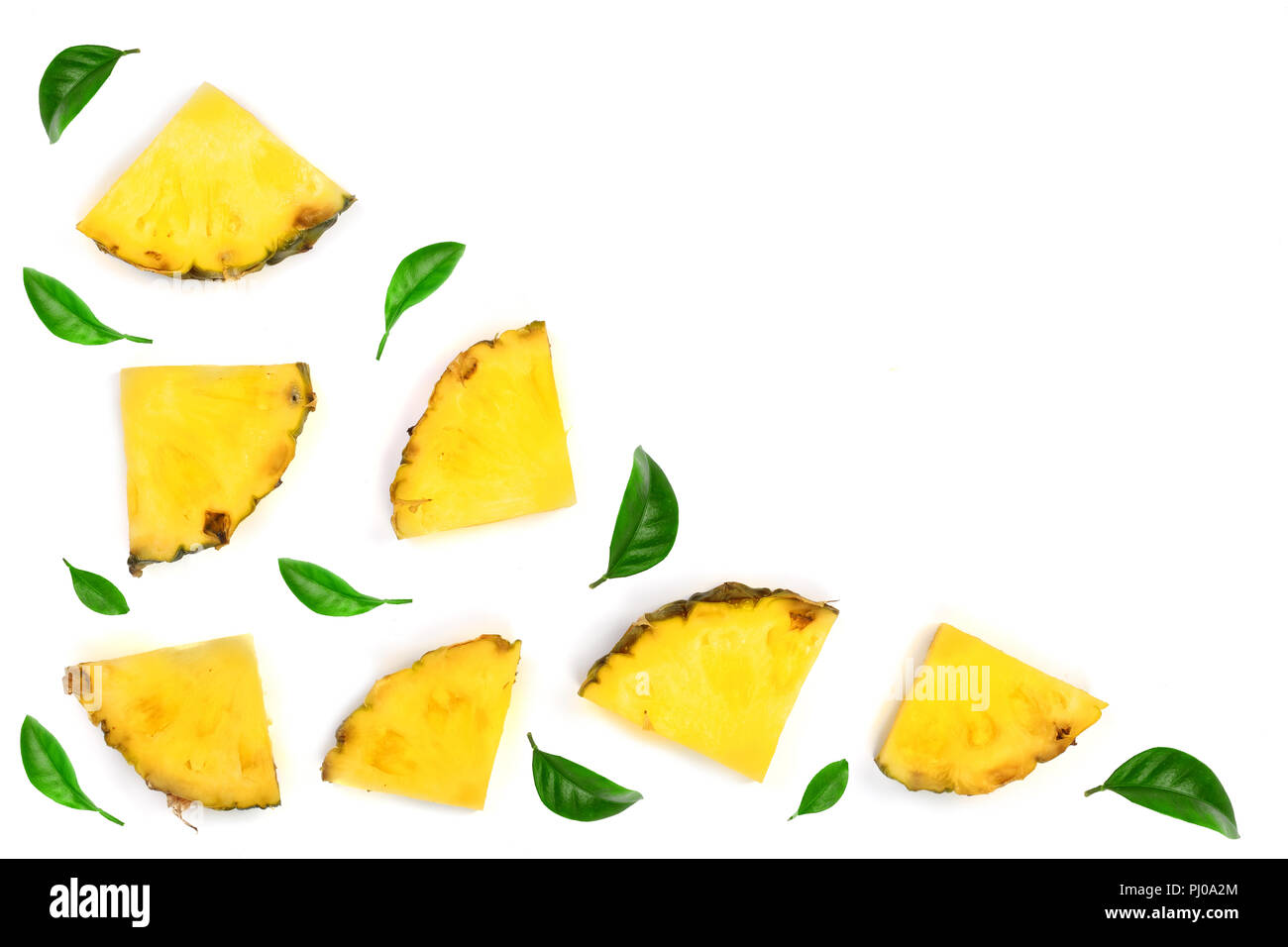 Sliced pineapple decorated with green leaves isolated on white ...
