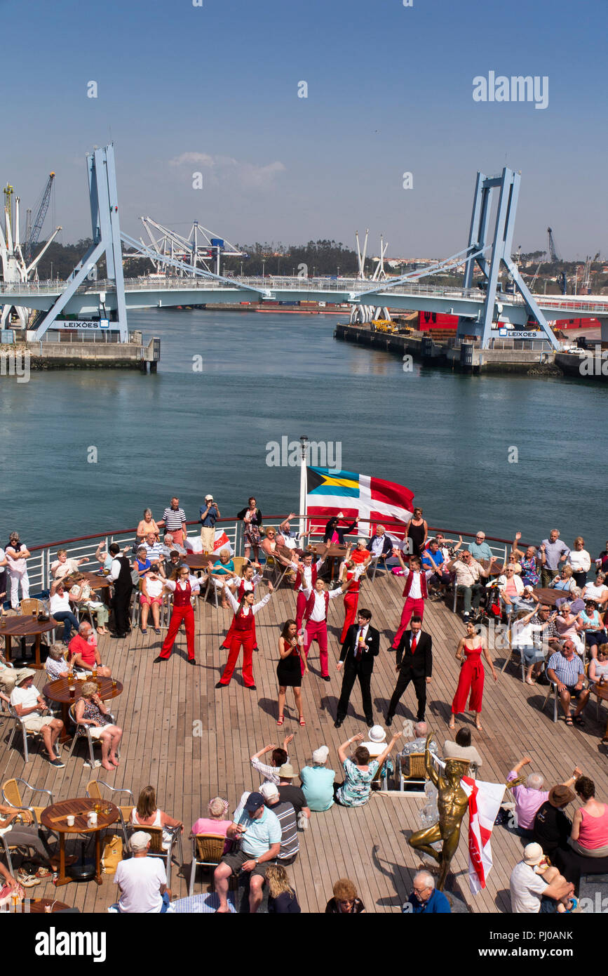 Portugal, Porto, Matosinhos, Leixoes, MV Marco Polo passengers being entertained on deck in sunshine Stock Photo