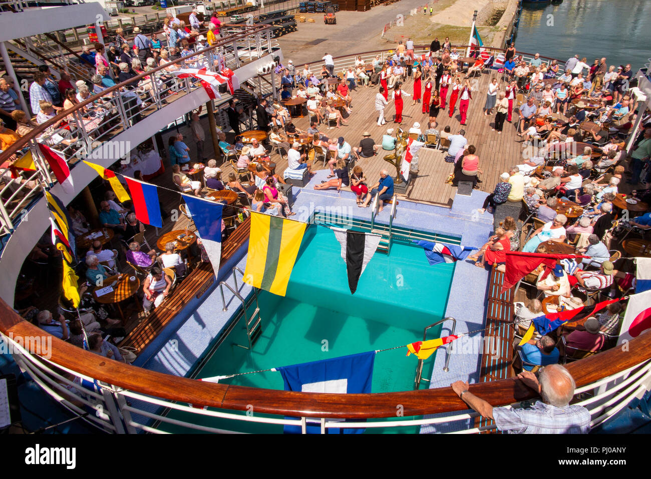 Portugal, Porto, Matosinhos, Leixoes, MV Marco Polo passengers being entertained on deck in sunshine Stock Photo