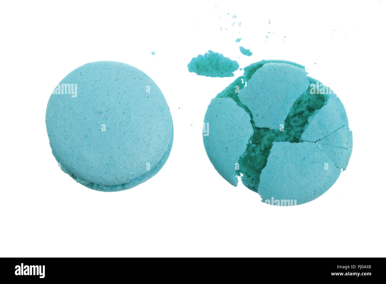 broken blue macarons isolated on white background closeup Stock Photo