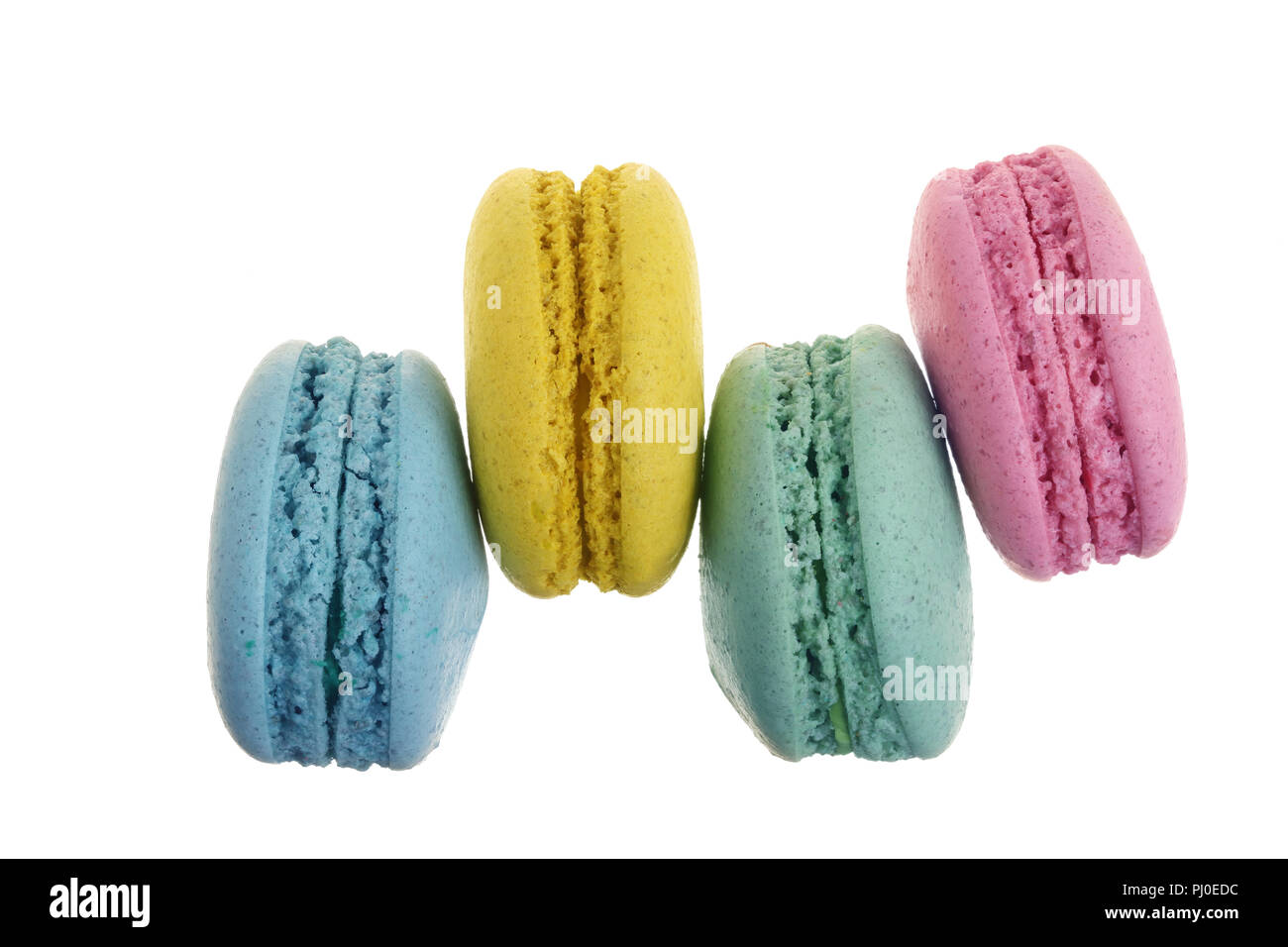 colored macaroons isolated on white background without a shadow closeup. Top view. Flat lay Stock Photo