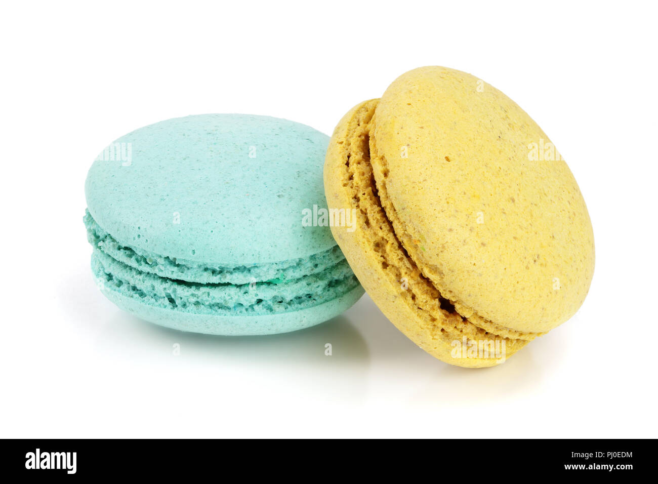 blue and yellow macaroon isolated on white background closeup Stock Photo
