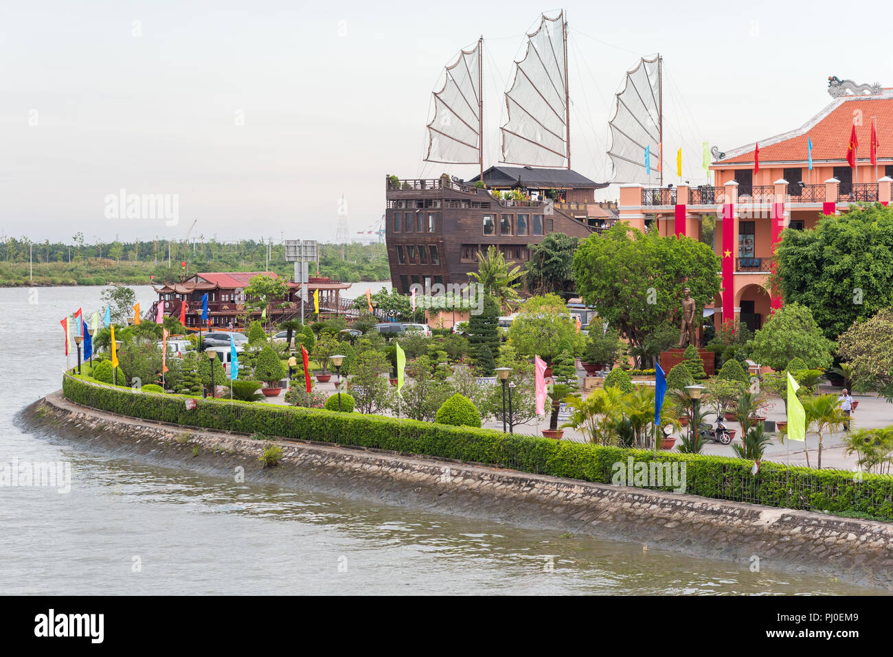 Ho Chi Minh City, Vietnam - April 27, 2018: a harbor on the Saigon River, Elisa Floating Restaurant (in the shape of a ship) and Ho Chi Minh Museum. Stock Photo