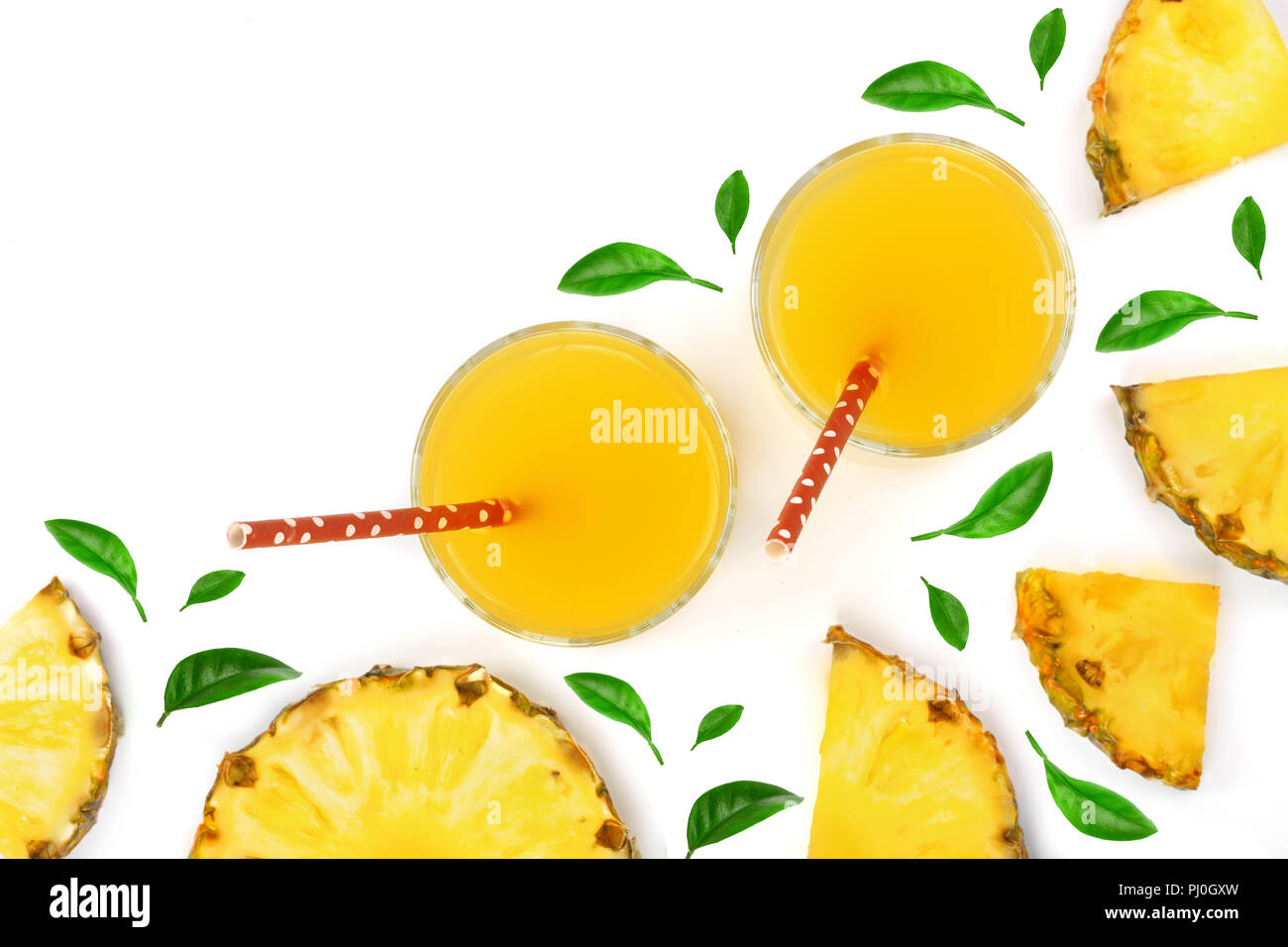 pineapple juice in a glass and pineapple slices decorated with green ...