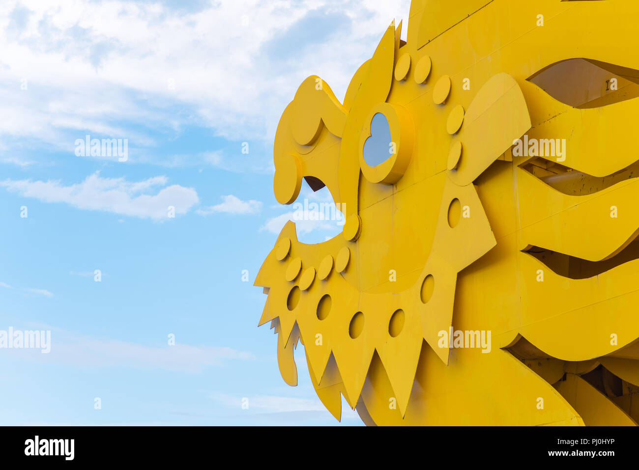 Da Nang, Vietnam - May 7, 2018: a dragon's head against the blue sky, a detail of the Dragon Bridge located in the central part of the city. Stock Photo