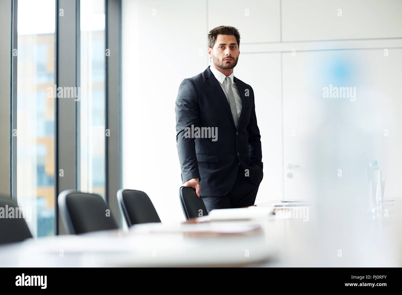 Businessman Alone in Office Stock Photo