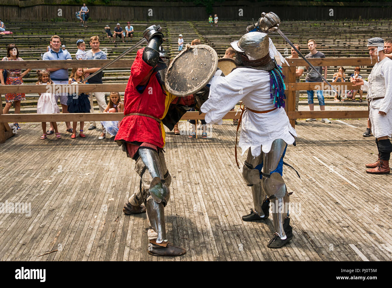 Lviv , Ukraine – august , 04, 2018:  Festival of medieval history and knight duels in the city park in Lviv.Knights fight in group battles Stock Photo