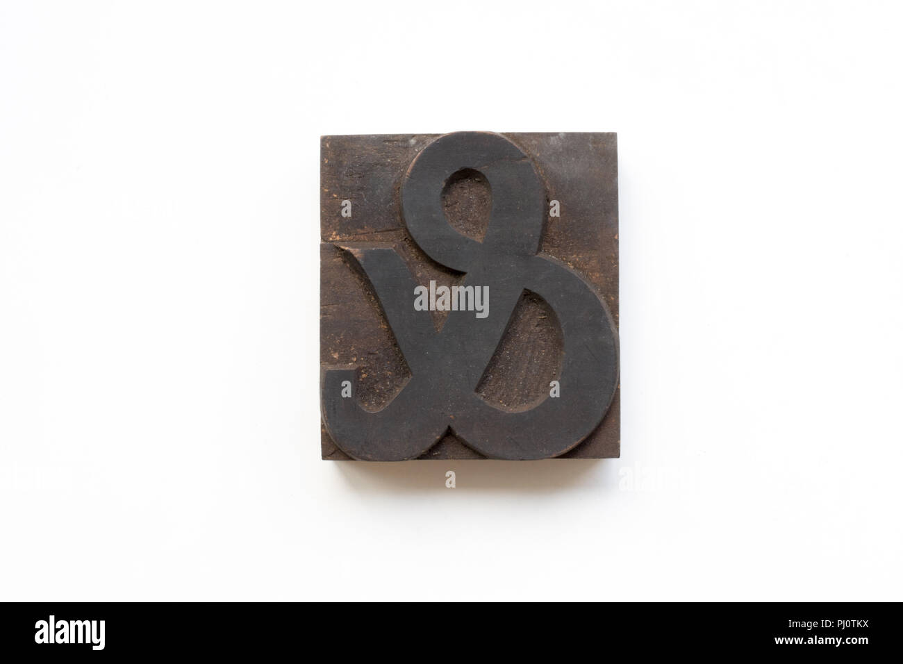 Letterpress Ampersand printing block isolated on a white background Stock Photo