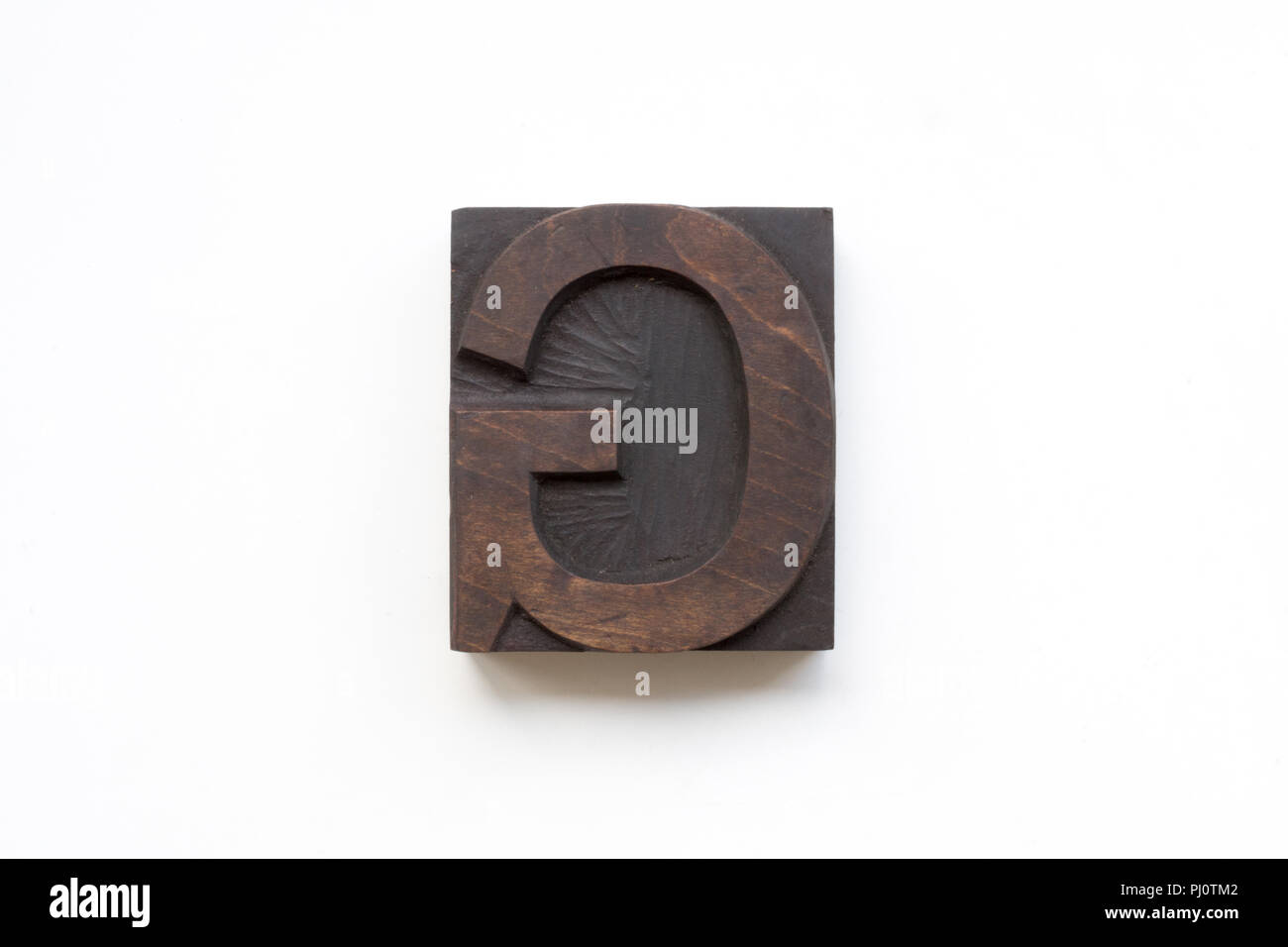 Letterpress letter G printing block isolated on a white background Stock Photo
