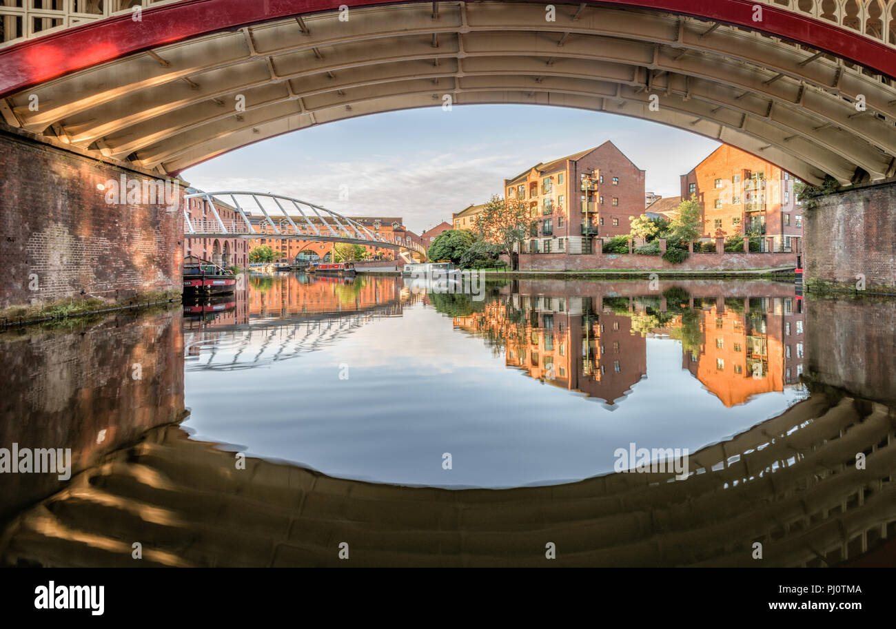 Under the Castlefield Viaduct looking across the Bridgewater Canal  towards the Merchant's Bridge in Manchester Stock Photo