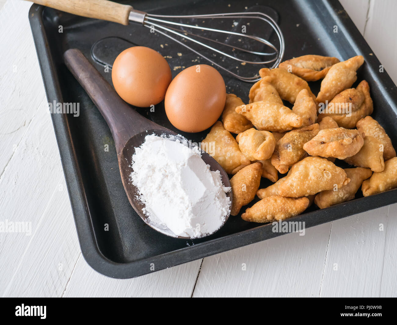 Karee puff, eggs and powder on white wooden background, Ingredients for cooking baking - flour, Stock Photo