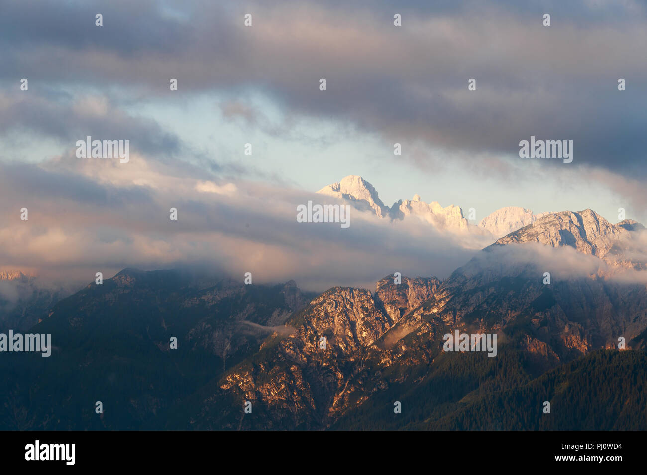 Magical dolomites mountains with snow and white clouds in Italy Stock ...