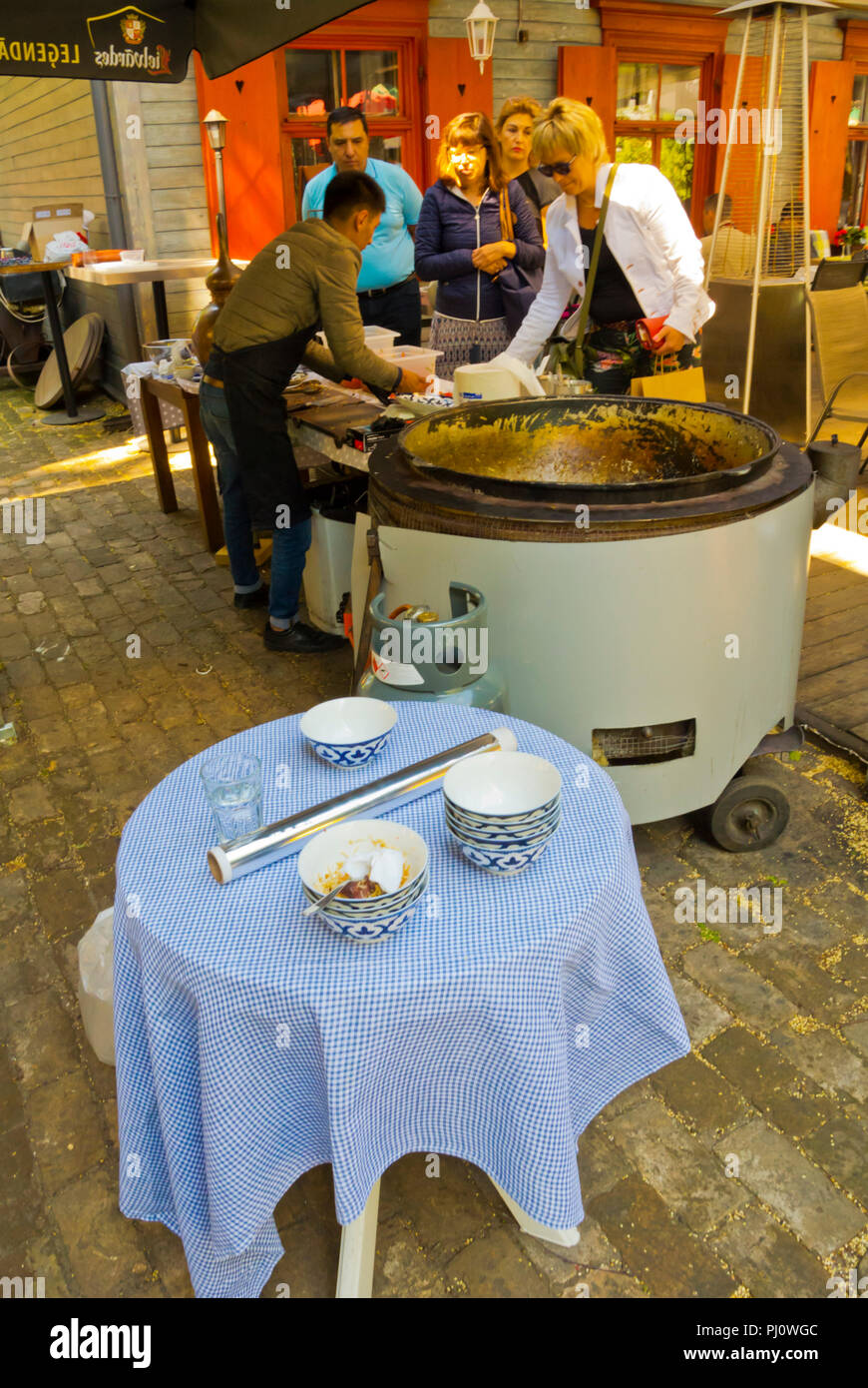 Preparation and selling of Plov, rice based Central Asian dish, Restaurant Maja, Kalnciema kvartals, Riga, Latvia Stock Photo