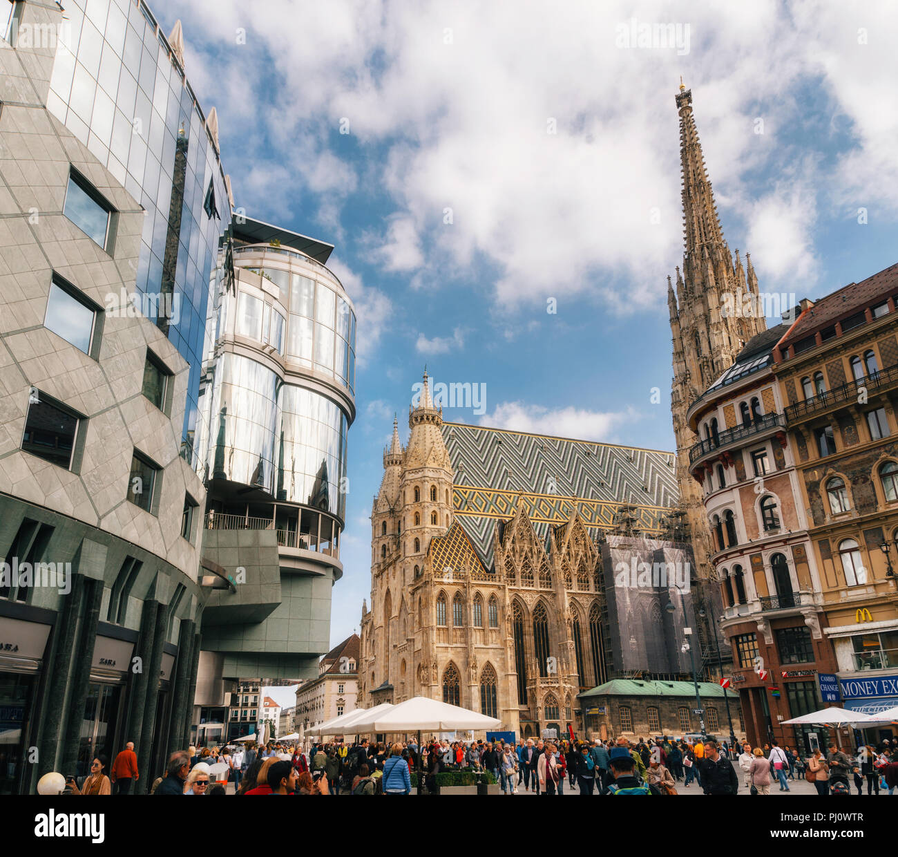 Vienna, Austria, 1 October, 2017: St Stephen's church and surrounding modern buildings Haas Haus with many tourists in Stephansplatz Stock Photo