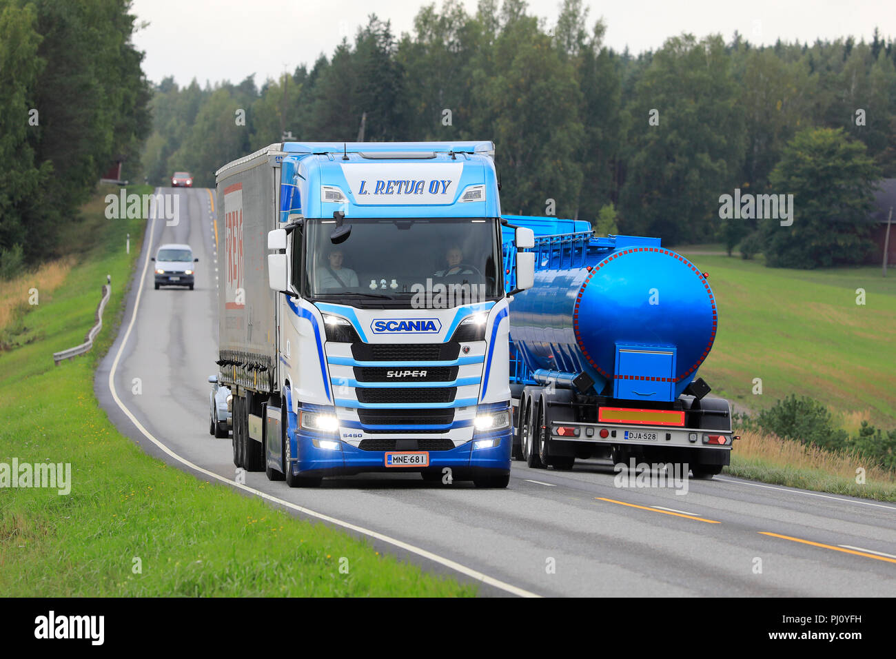Salo, Finland - September 1, 2018. Blue and white Next Generation Scania S450 truck of L. Retva hauls Freja cargo trailer in highway truck traffic. Stock Photo