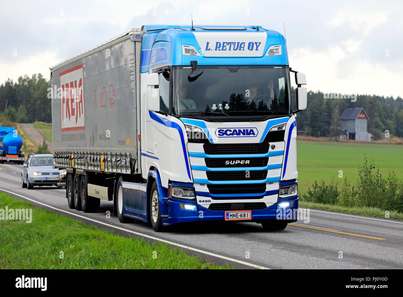 Salo, Finland - September 1, 2018. Blue and white Next Generation Scania S450 truck of L. Retva hauls Freja cargo trailer in highway traffic. Stock Photo