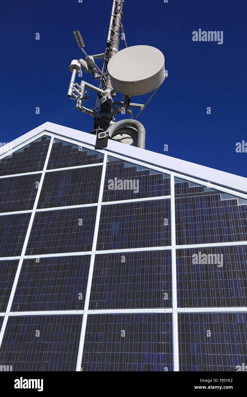 Rooftop solar electric power station and telecommunication beam antenna Stock Photo