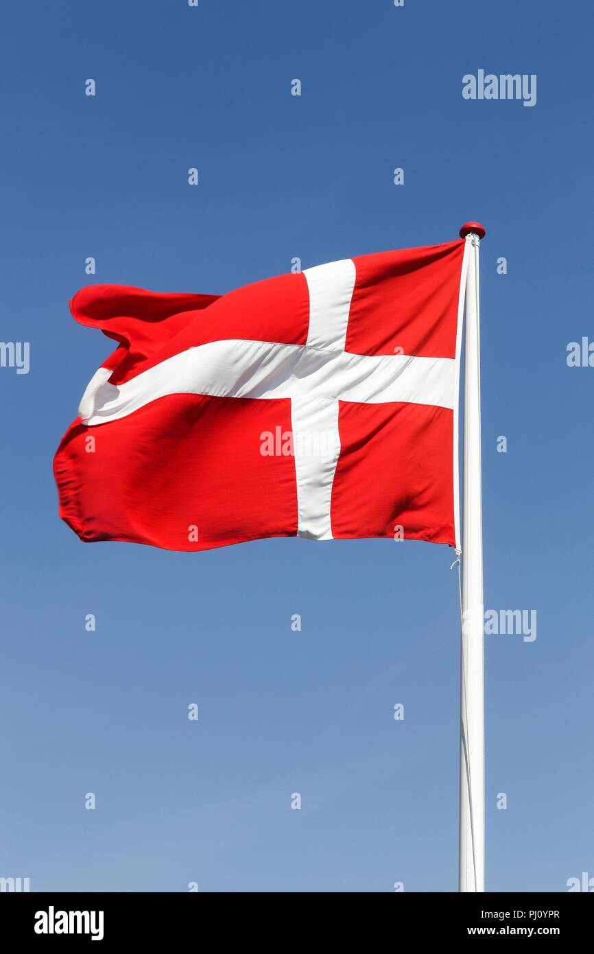Flag of Denmark waving in the sky Stock Photo