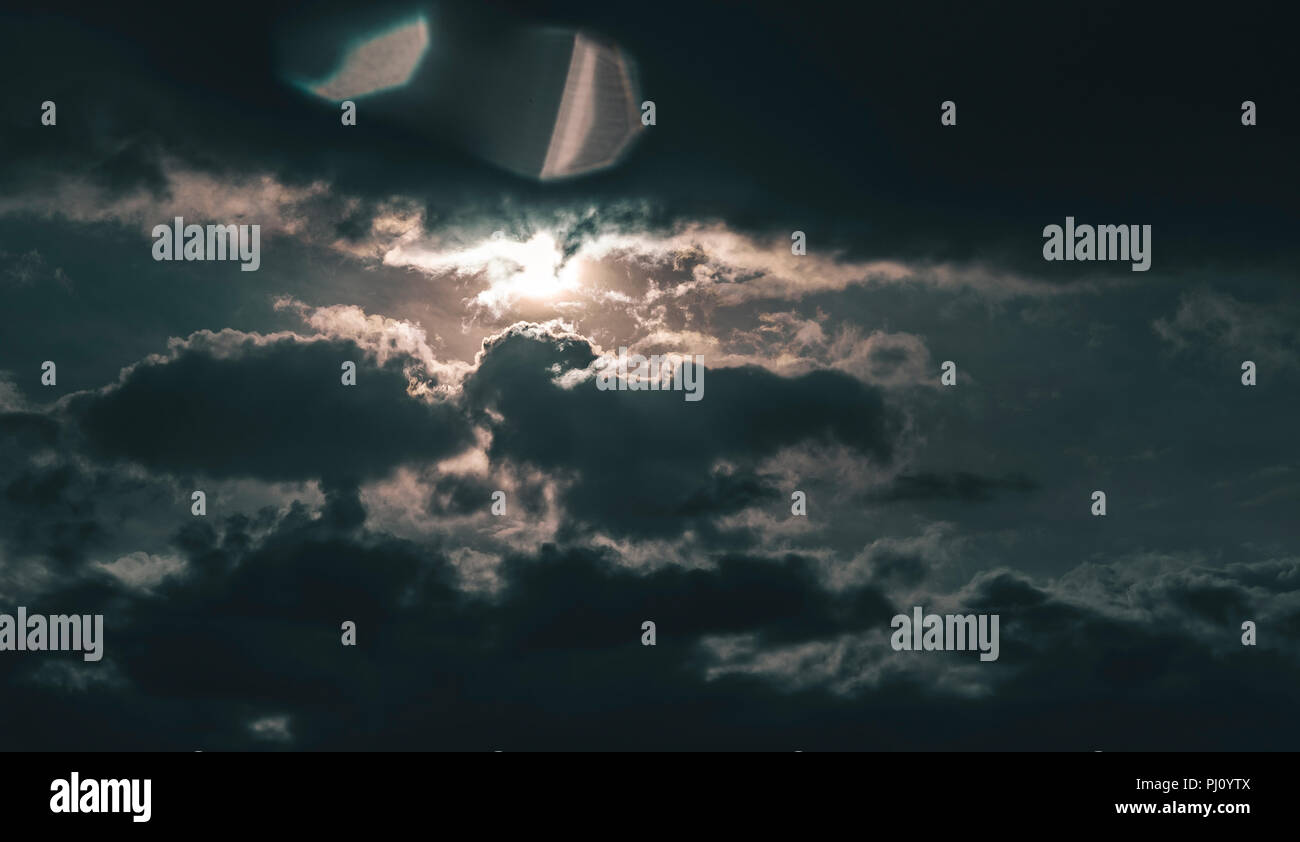bright sun, dark Clouds. Mystic and epic sky Stock Photo