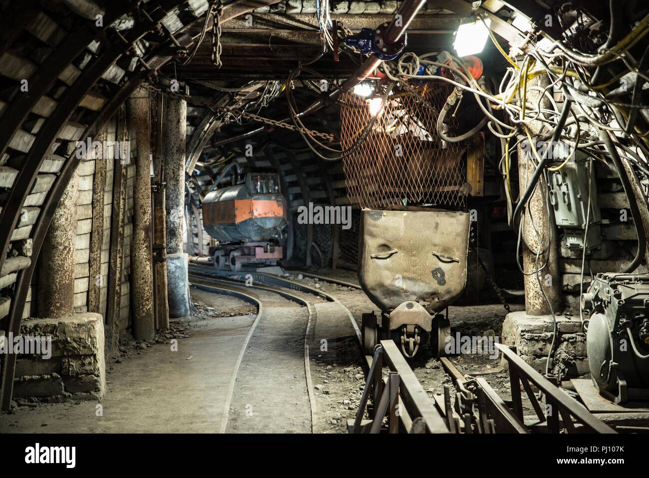 Coal wagons on a tracks in an underground coal mine Stock Photo Alamy
