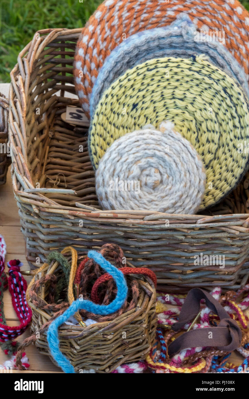 various coloured wools and threads on a craft stall at a country and hobby fair. Stock Photo