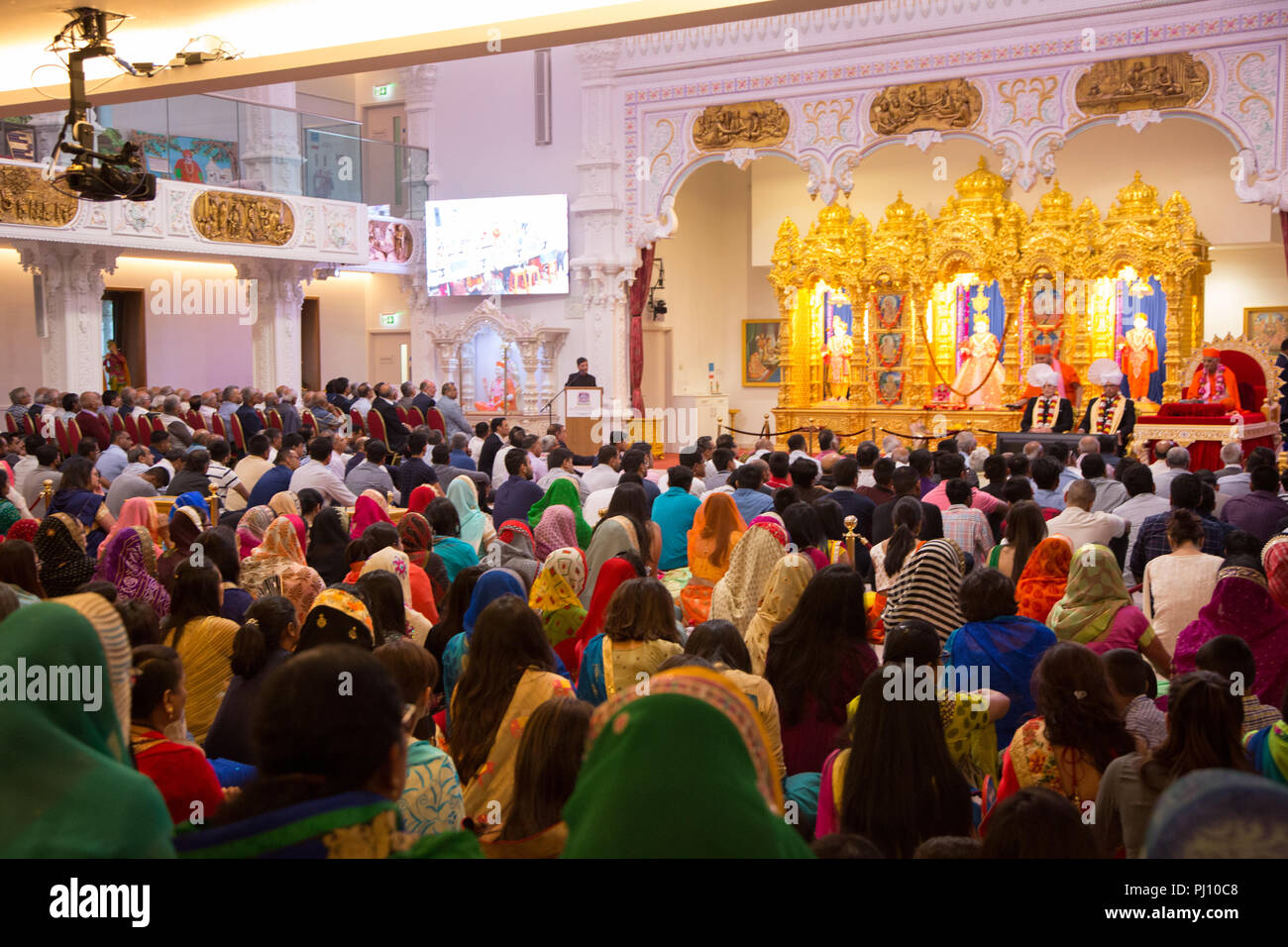 Worshippers at a Hindu temple in Kingsbury, North West London Shree Swaminarayan Mandir Stock Photo