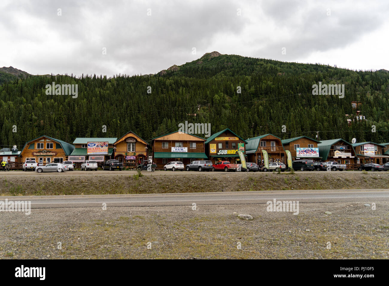 AUGUST 10 2018 - DENALI NATIONAL PARK, AK: Row of retail souvenir shops and restaurants line the George Parks Highway known as Glitter Gulch Stock Photo