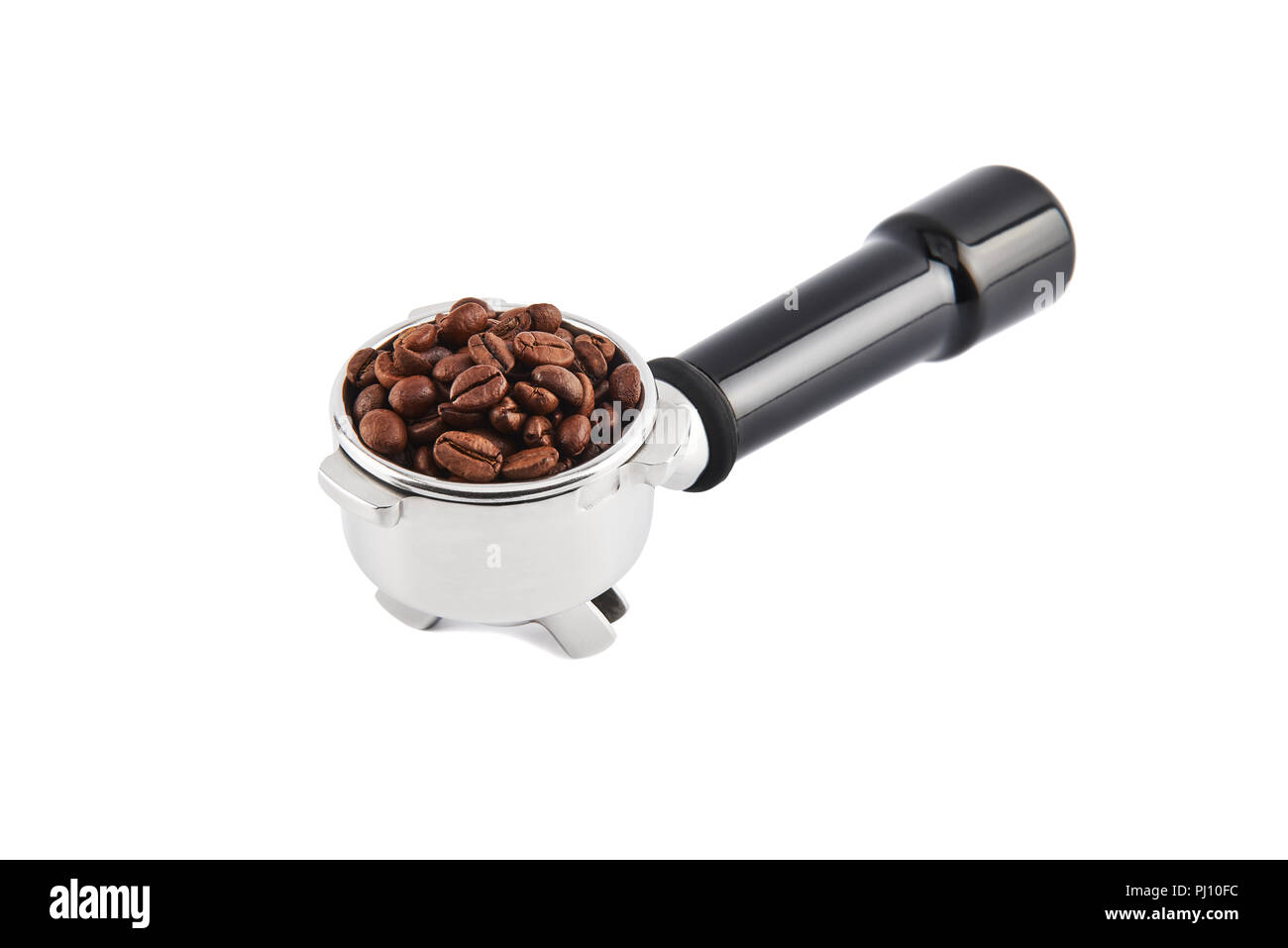 Portafilter filled with whole coffee beans isolated on white background. Filter holder for espresso coffee machine. Black Espresso handle. Stock Photo