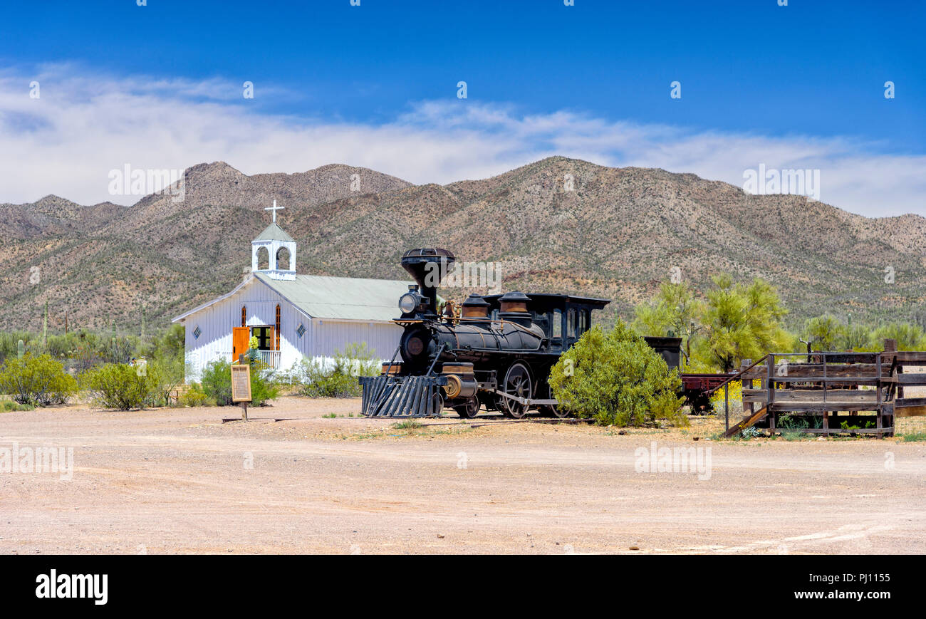 Old steam train in front of Church in Old Tucson Stock Photo